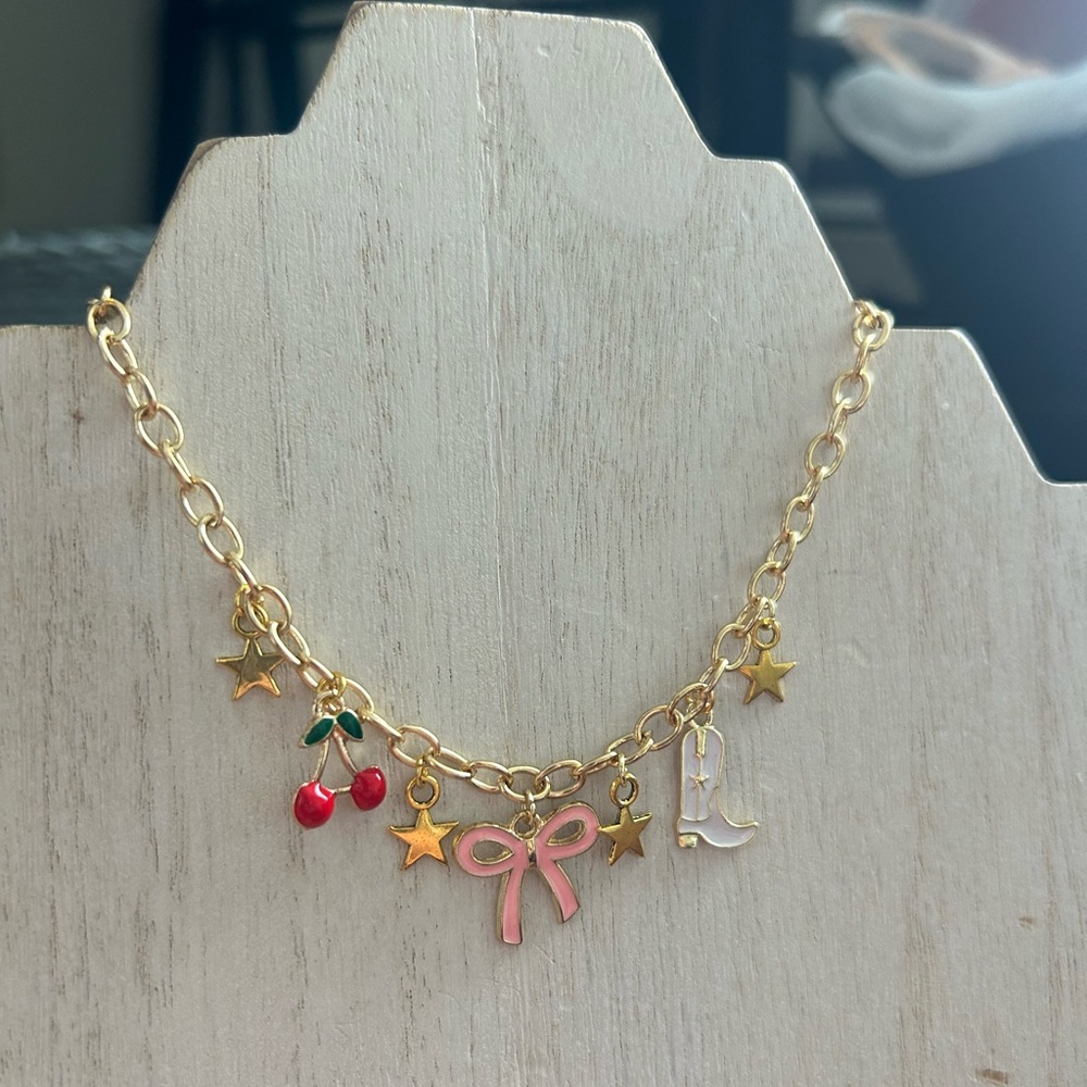 Charm necklace with matching bow earrings